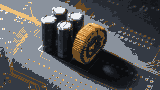 Capacitors and a ferrite choke on a board